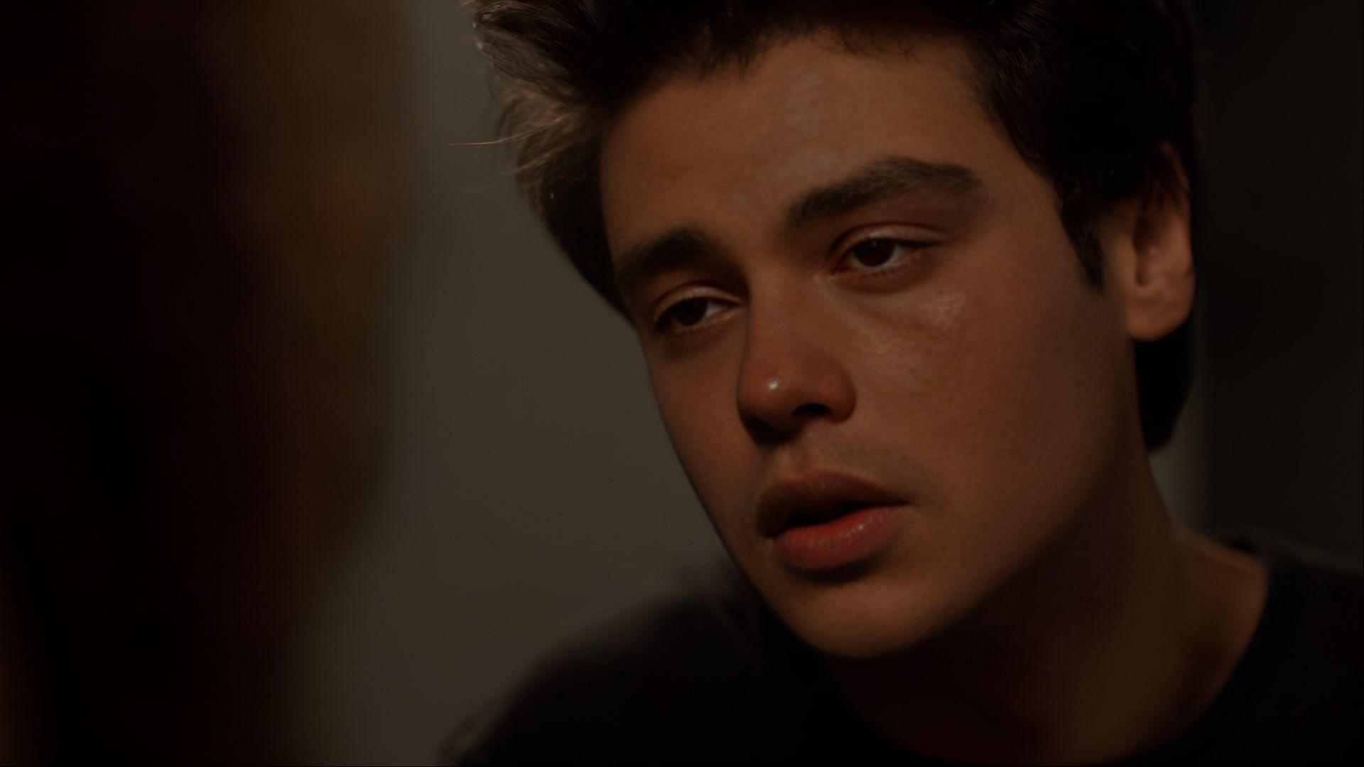 Marcus stares blankly, overwhelmed by emotion, in one of the more intense depictions of his mental health struggles in Ginny & Georgia season 3 (Image via Netflix)